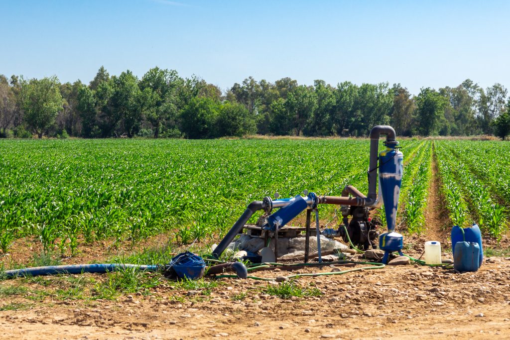 Agricultural Technology: Irrigation Pump in Corn Field.