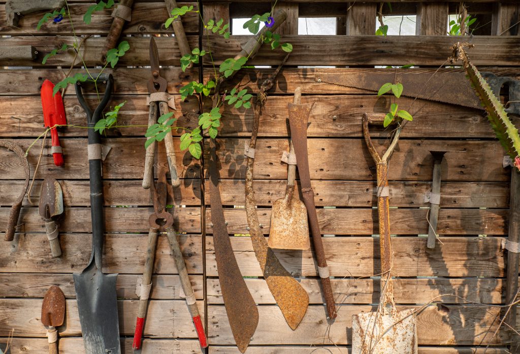 Agriculture tools, Agricultural equipments on wooden wall, retro tools background, vintage wallpaper tools.