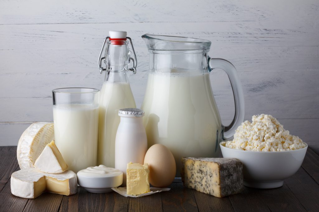 Dairy products on wooden table still life