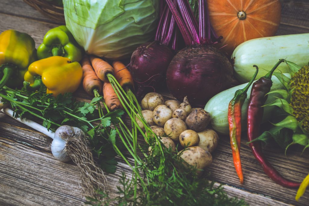 Fresh vegetables on old wooden table