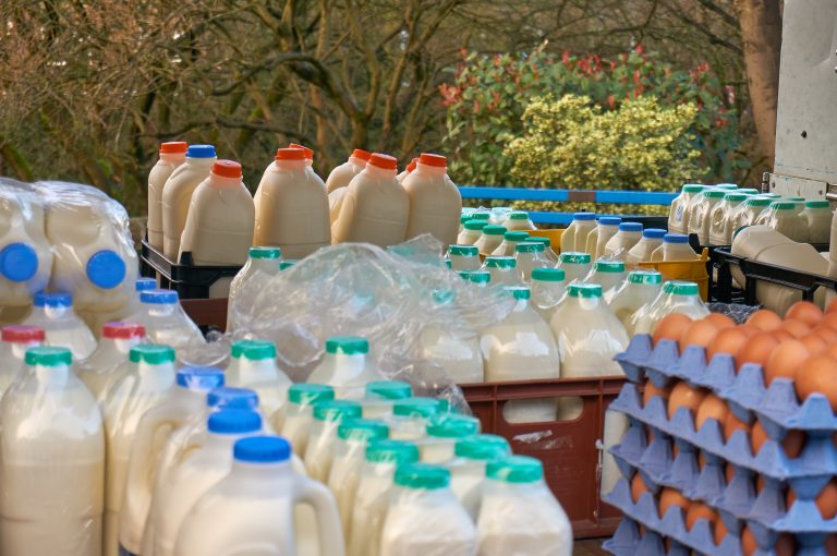 Milk and eggs being carried on an open-sided delivery vehicle