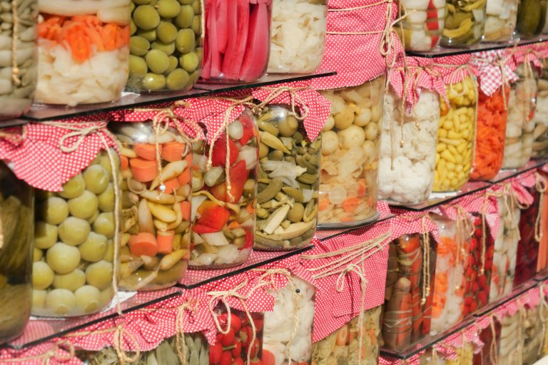 A shelf filled with lots of different types of food