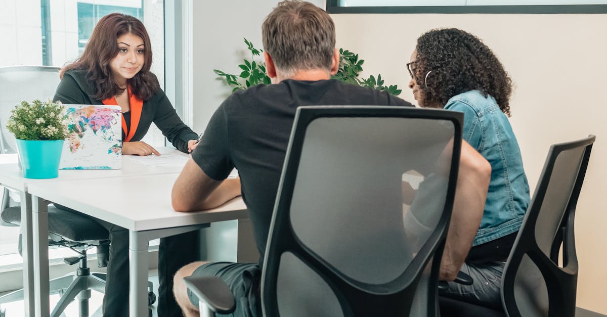 a business advisor consults with clients in a modern office setting fostering teamwork and cooperat