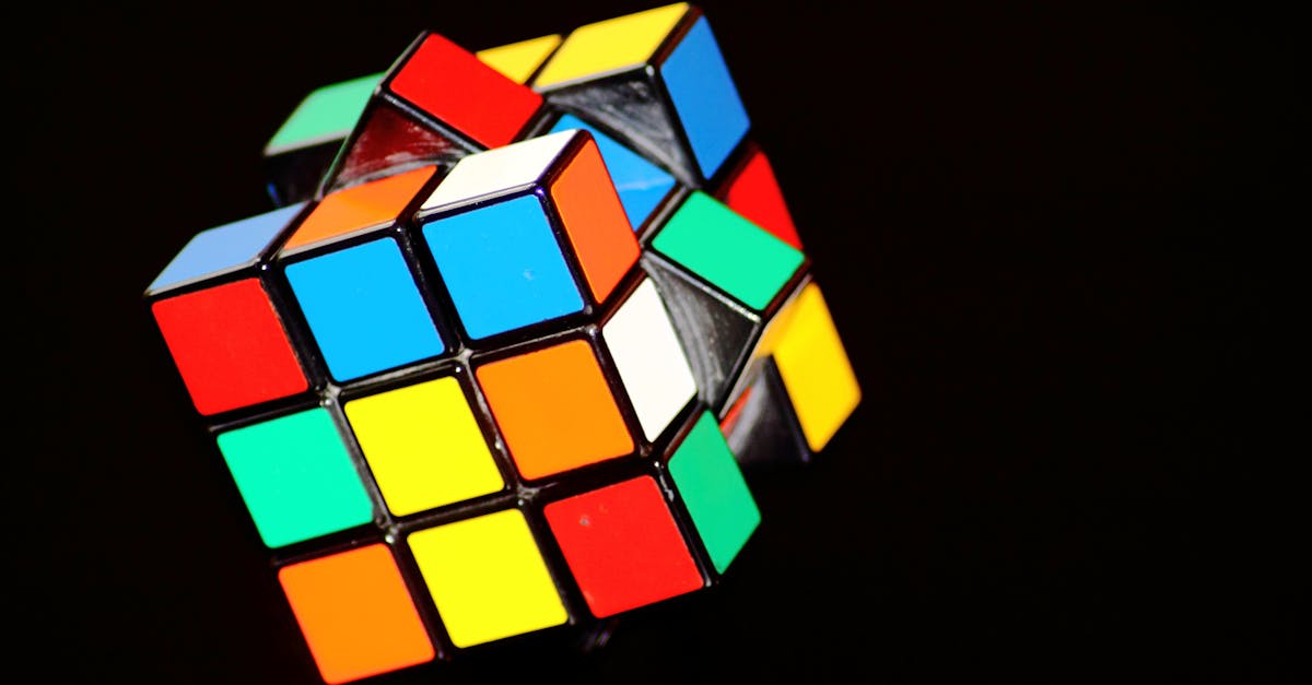 a close up of a colorful rubik s cube puzzle showcasing concentration and play