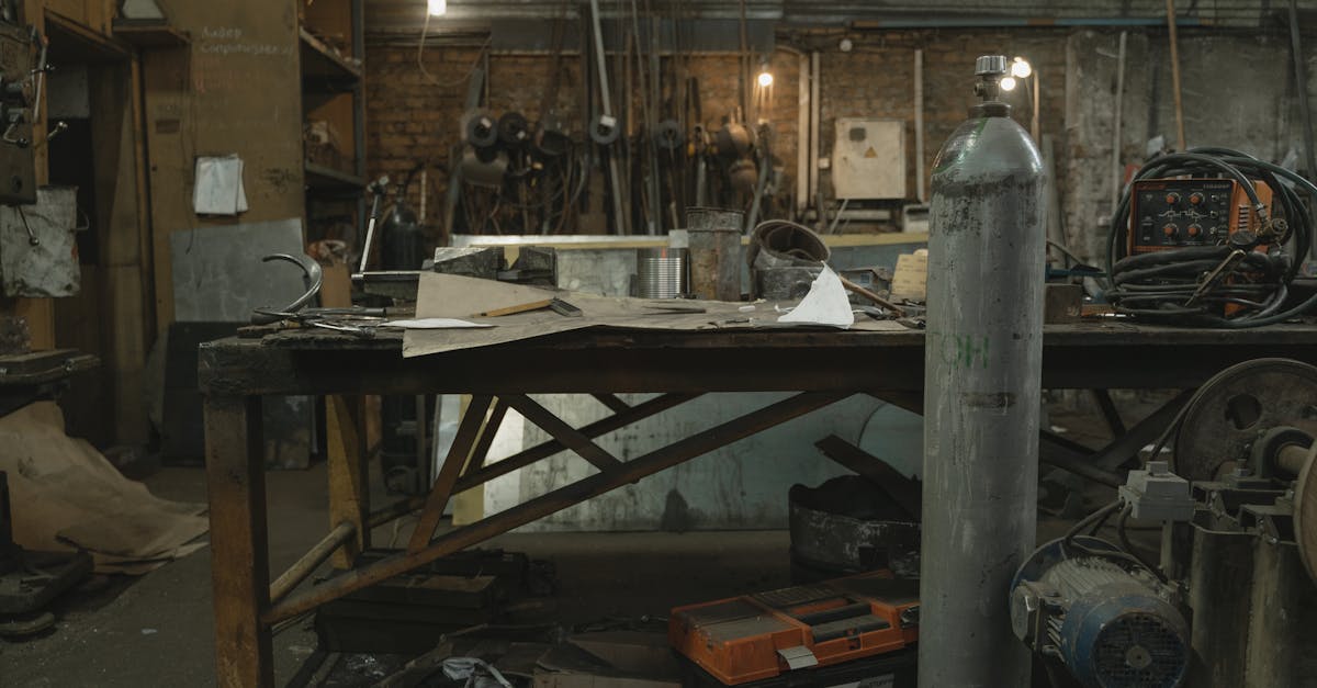 a cluttered blacksmith workshop showcasing various tools metalworking equipment and a rustic indu