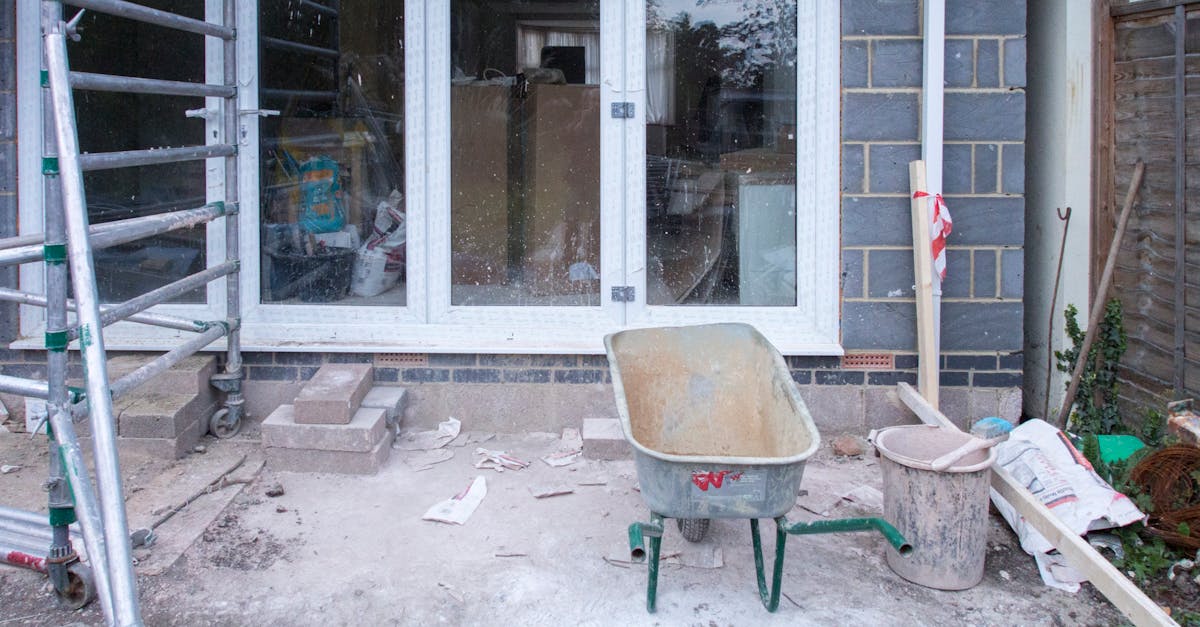 a construction site showcasing home renovation with scaffolding and tools