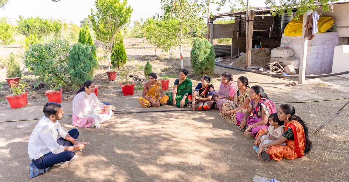 a diverse group gathered for a community meeting in rural nagpur india discussing agriculture