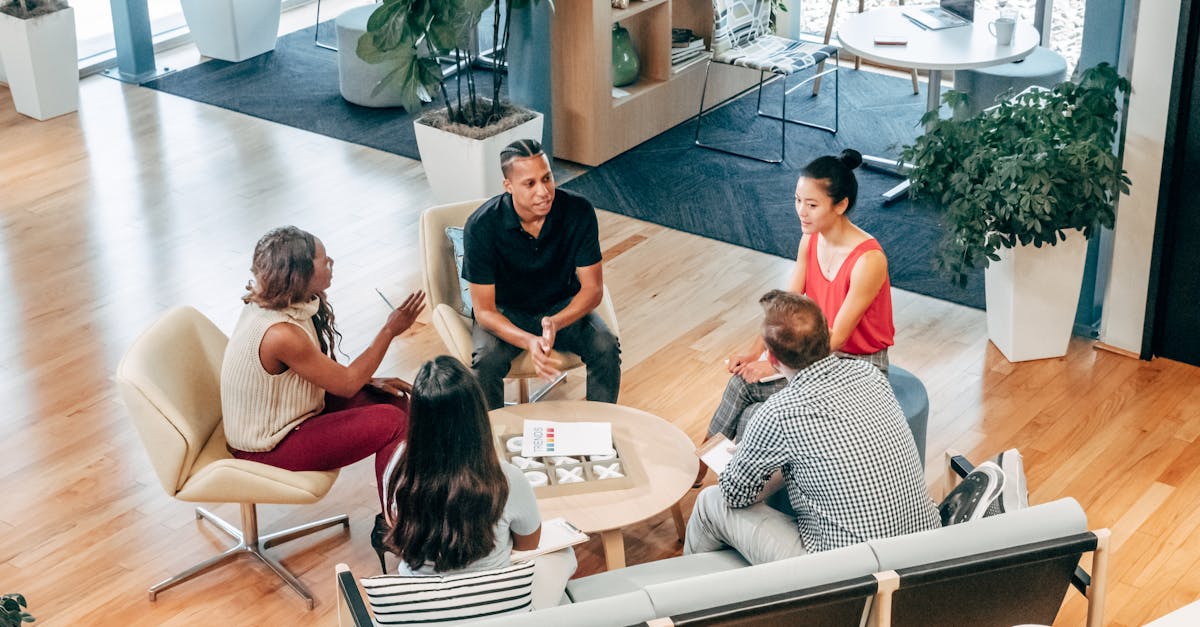 a diverse group of professionals engage in a collaborative team meeting in a stylish office environm 1