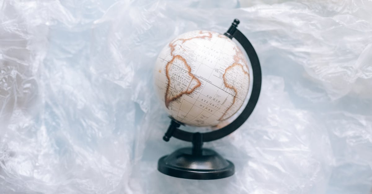 a globe wrapped in plastic symbolizes environmental issues and the need for sustainability