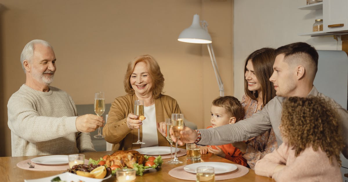 a joyful family toasts together over a festive dinner with champagne indoors