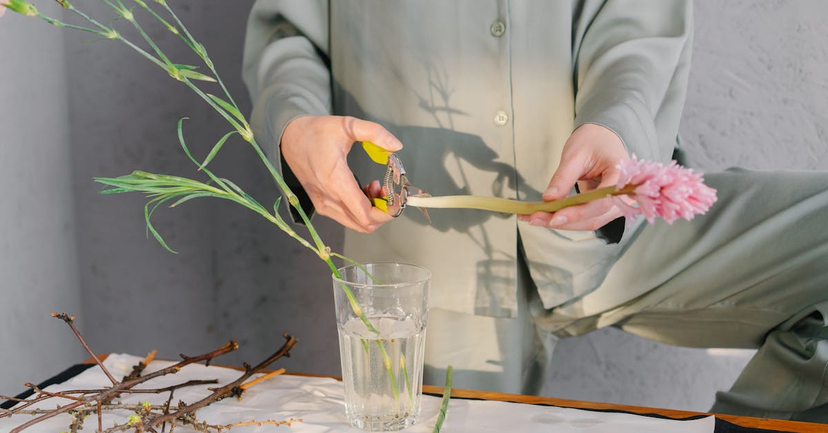 a person trims flowers for a floral arrangement emphasizing creativity and mindfulness