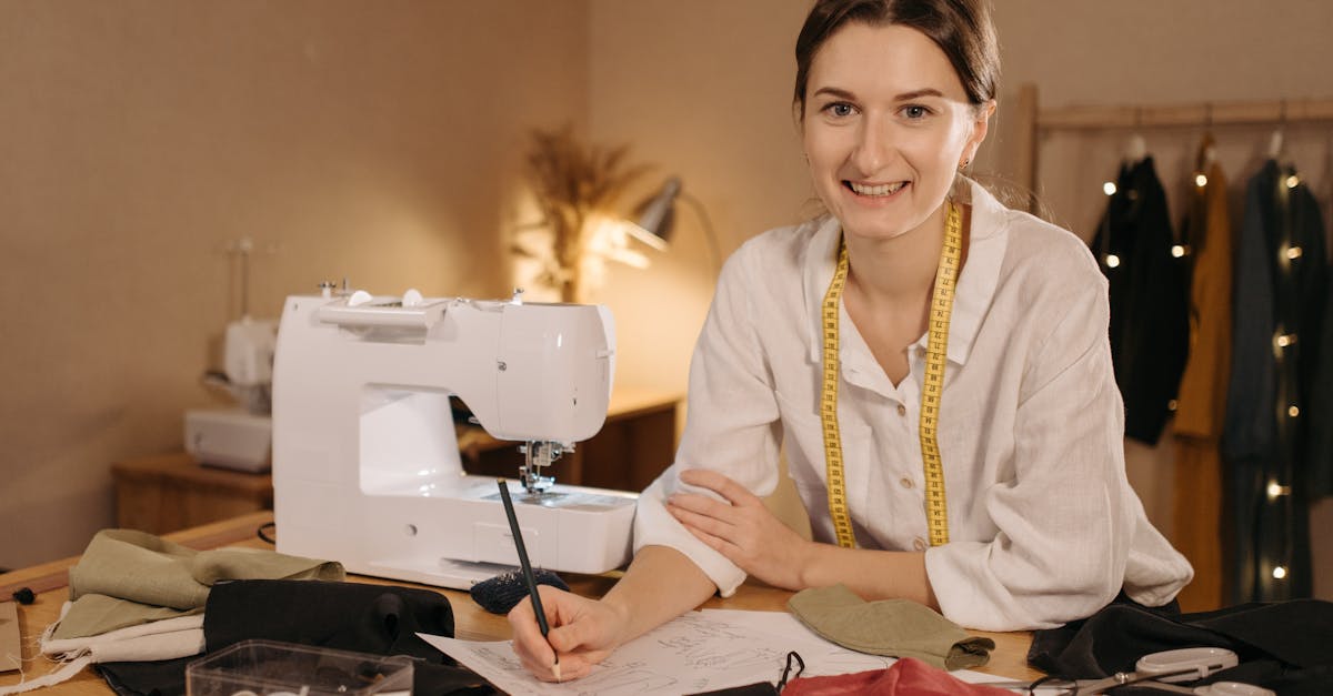 a smiling seamstress working at her table with sewing tools and fabric promoting a small business a