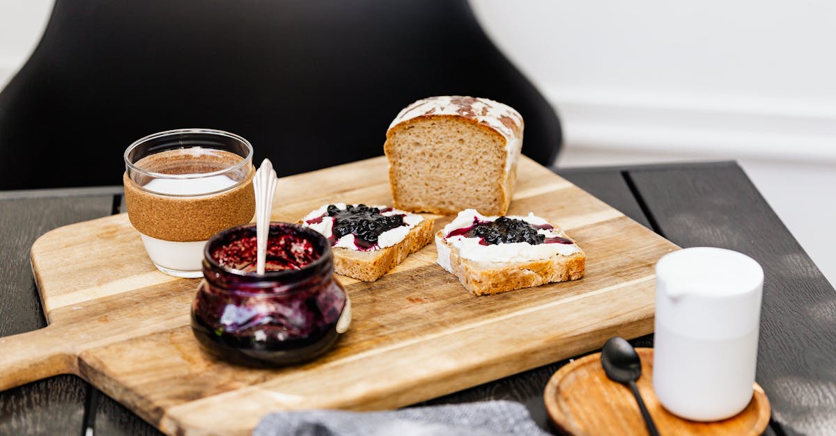 appetizing breakfast setup with bread jam and milk on a rustic wooden board offering a cozy morni