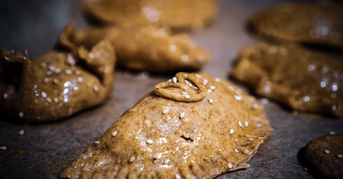 close up of rustic homemade pastries with sesame seeds showcasing golden brown dough and a deliciou 1