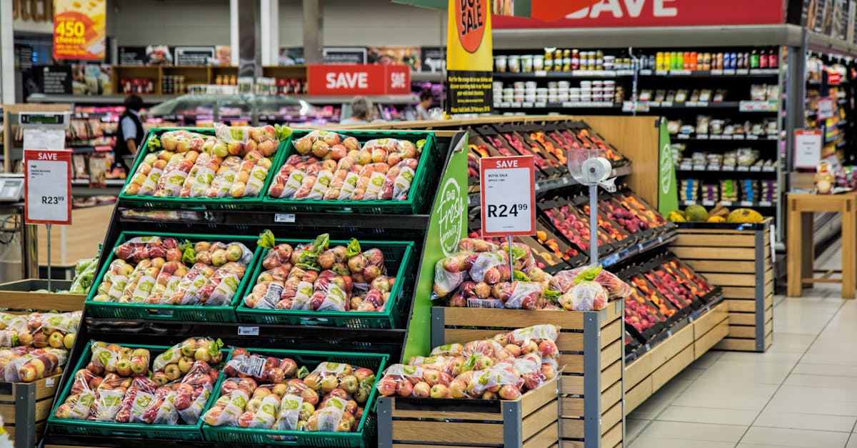 colorful produce aisle in a supermarket showcasing fresh apples with discount signage