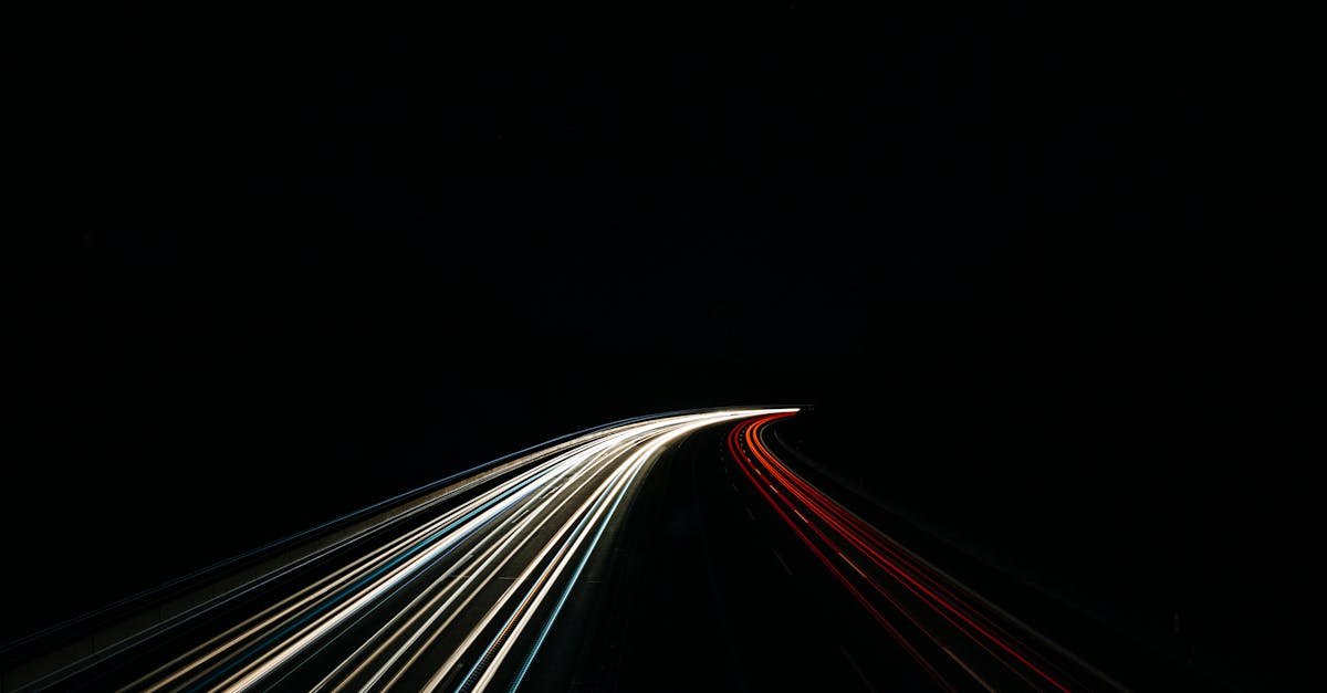 dynamic long exposure capturing light trails on a dark highway at night