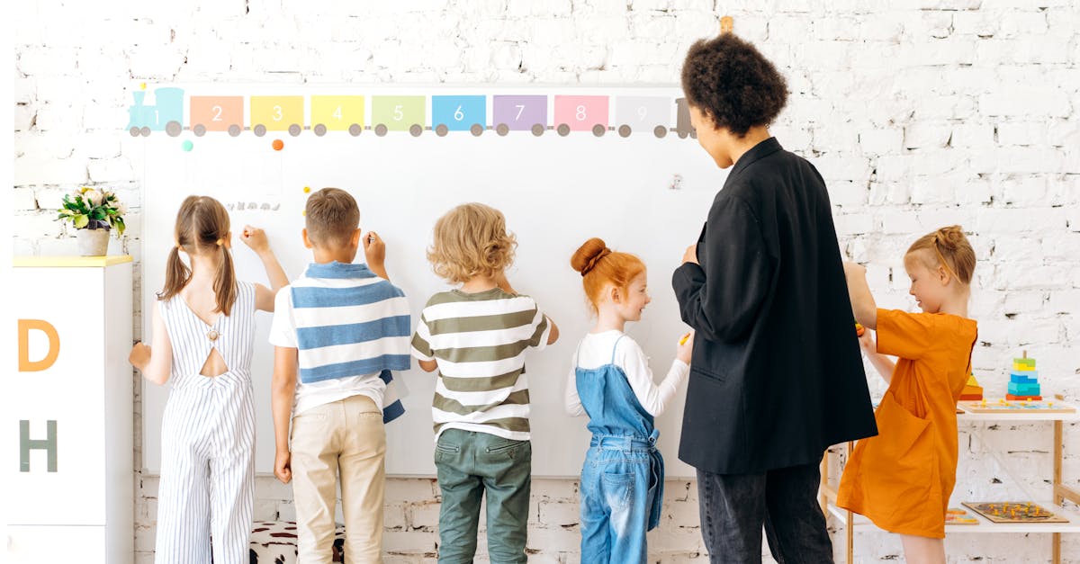 group of children and teacher interacting with a whiteboard in a bright indoor classroom setting