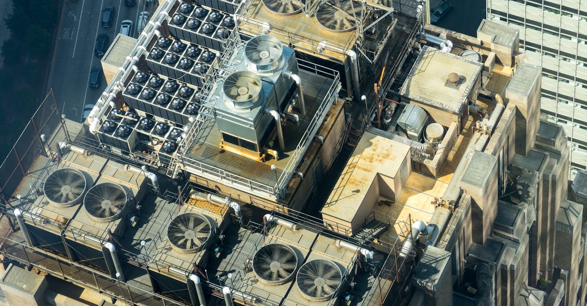 high angle shot of hvac units on a city building s rooftop showcasing industrial infrastructure