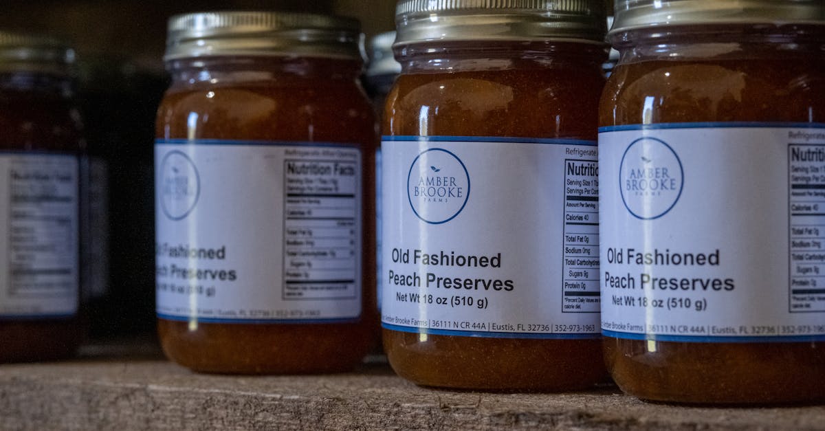 jars of old fashioned peach preserves on a rustic shelf ideal for advertisements