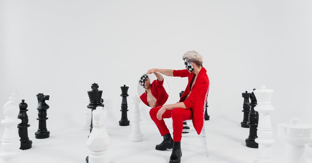 masked individuals in red amidst large chess pieces symbolizing strategy and creativity