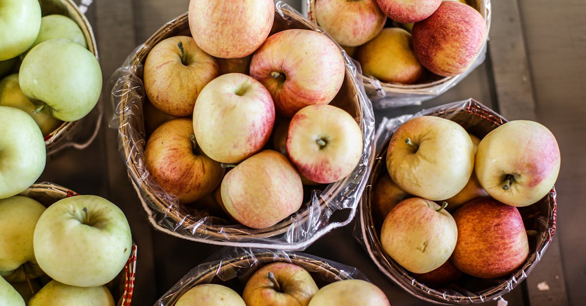 overhead view of baskets filled with fresh apples perfect for healthy diets and harvest themes