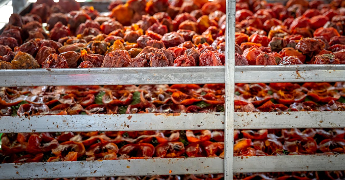 pile of tasty traditional japanese sun dried persimmons placed on metal stall in in food market mark