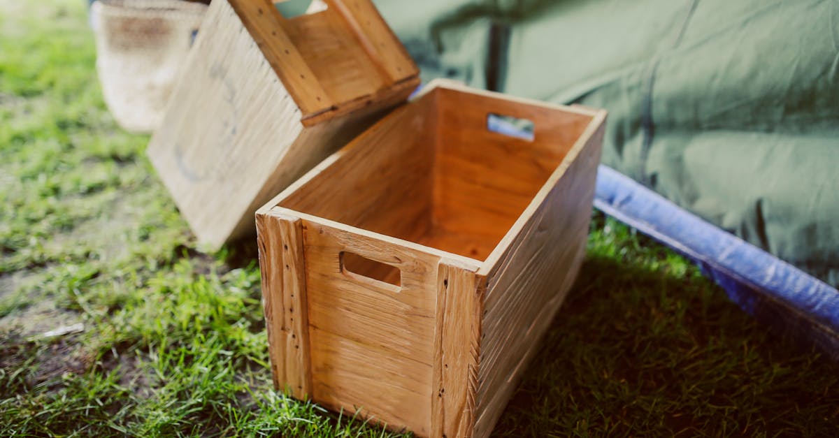 rustic wooden crates placed on grass in a rural outdoor setting perfect for garden decor