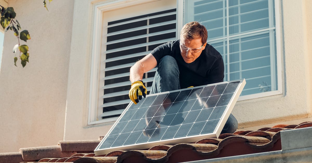 solar technician installing a photovoltaic panel on a rooftop promoting renewable energy