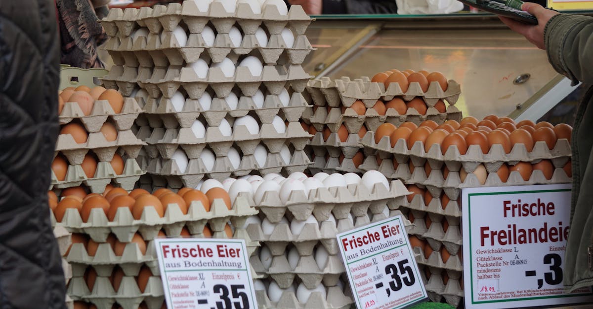 stacks of fresh eggs in trays on sale at a traditional market in frankfurt