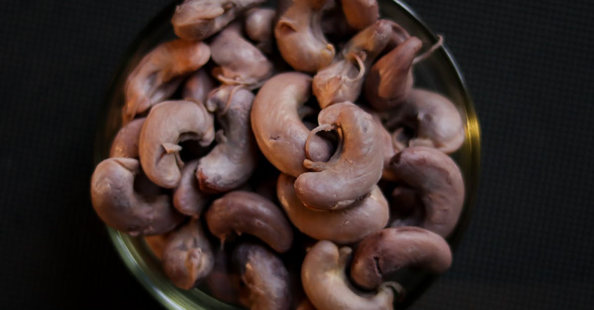 top view of raw cashew nuts piled in a bowl perfect for food and ingredient themes