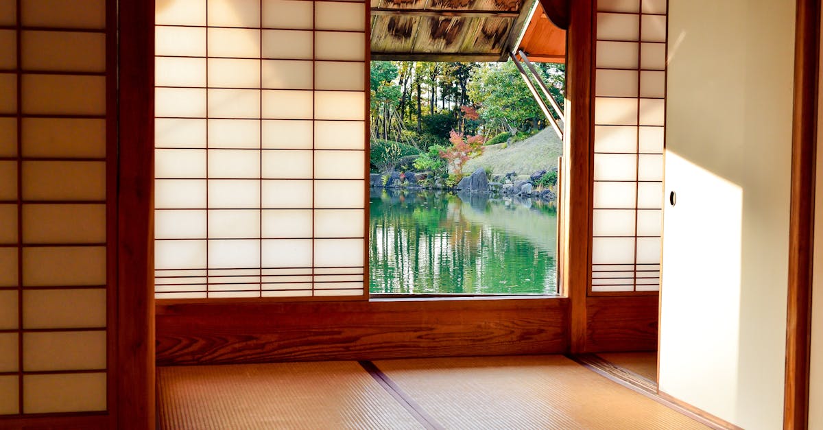 traditional japanese room with shoji screens and a view of a serene garden pond