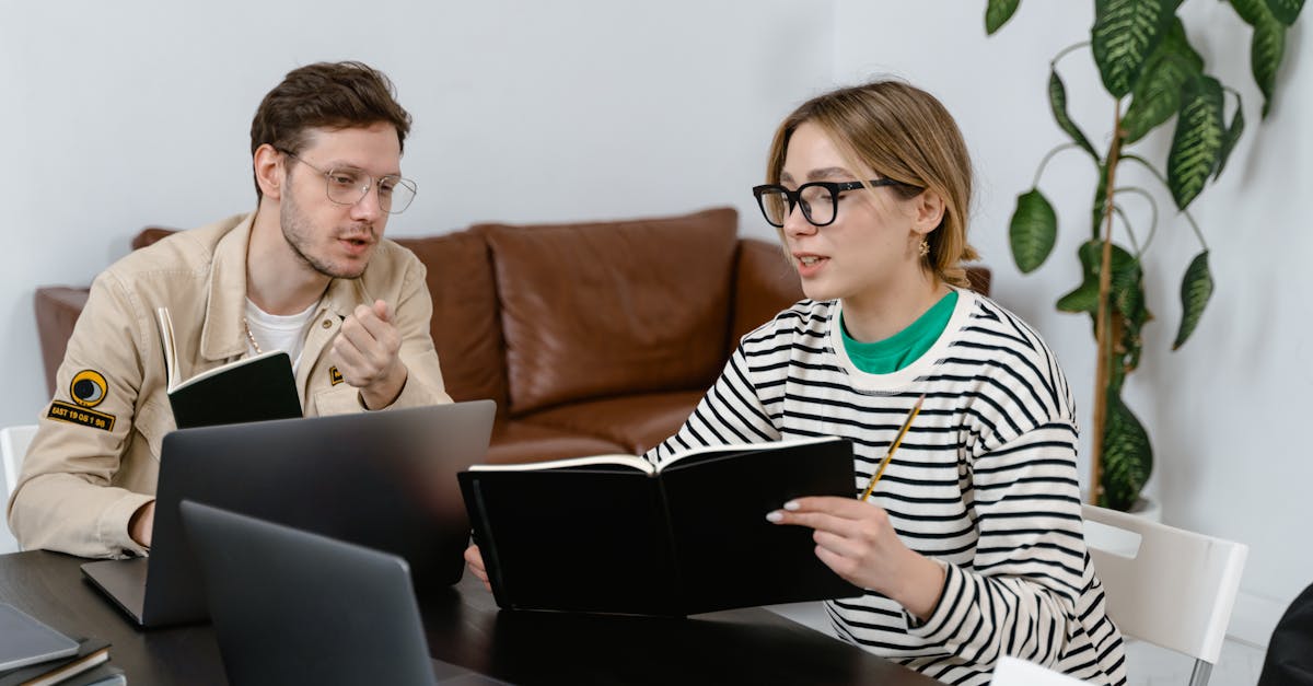 two colleagues engaged in a brainstorming session at a contemporary office workspace