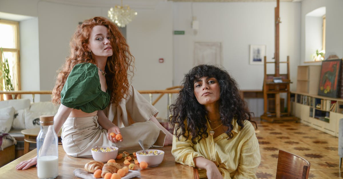 two fashionable women having breakfast together showcasing stylish and warm home ambiance